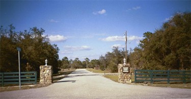 The main entrance to Prairie Creek West: Five-acre homesites and riding trails await within.